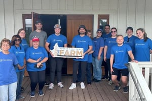 ORRM employees pose for a team picture on a porch
