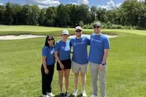 4 ORRM employees posing at a golf course