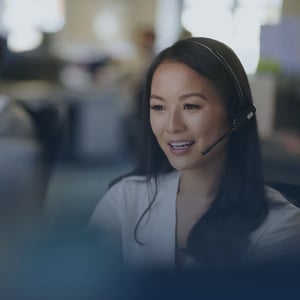 A woman call representative with a speaker headset