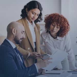 A team looking over a document