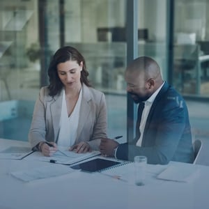 2 colleagues reviewing documents